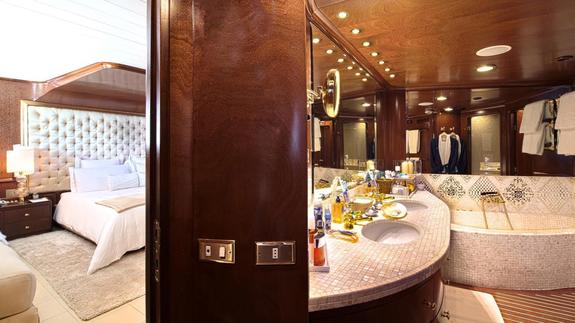 a bathroom with a large mirror aboard SIRAHMY Yacht for Sale