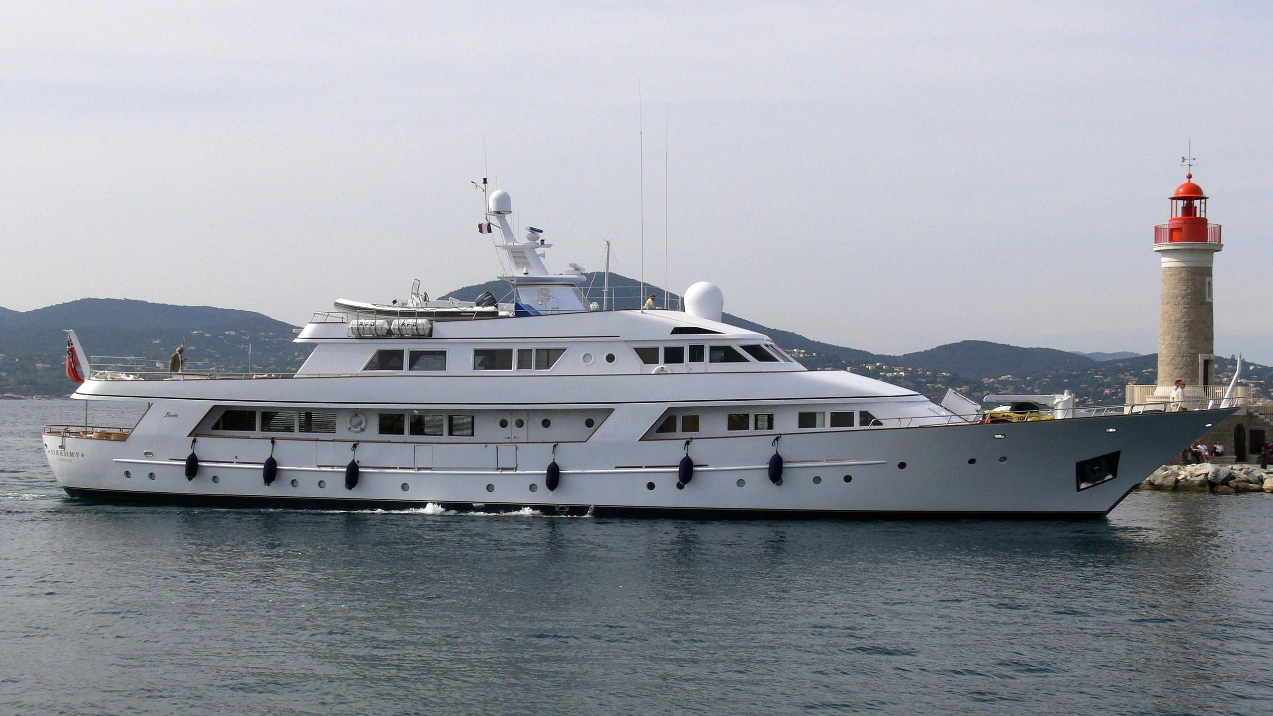 a large white boat in the water aboard SIRAHMY Yacht for Sale