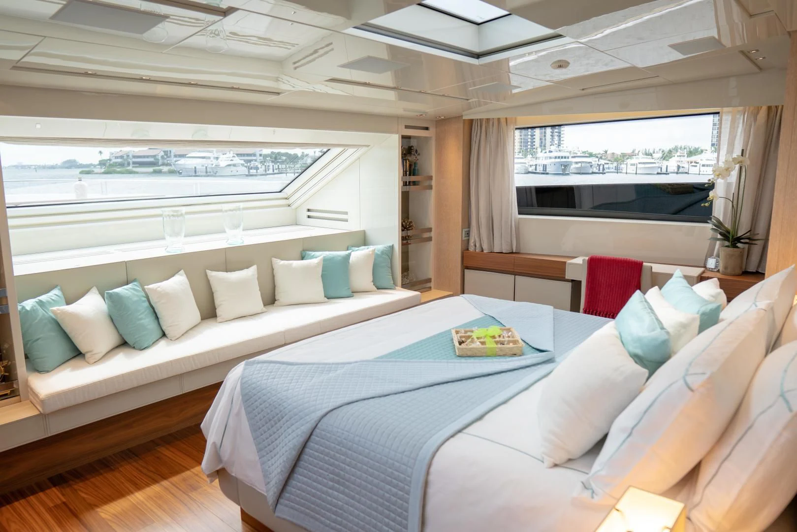 a room with a couch and a table with pillows aboard GOLDEN YACHT Yacht for Sale