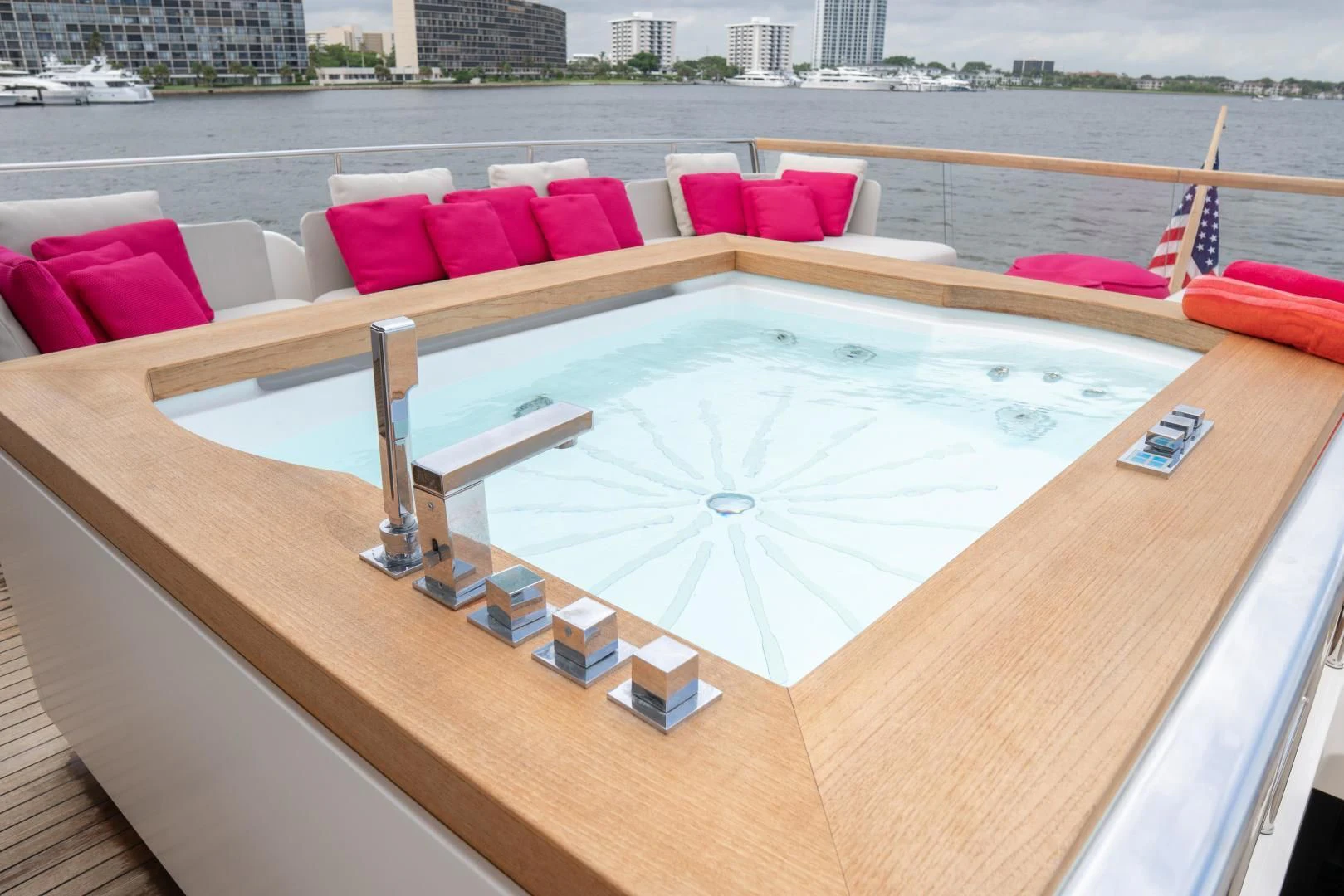 a large white table with a red couch and a white table with a red pillow on it and aboard GOLDEN YACHT Yacht for Sale