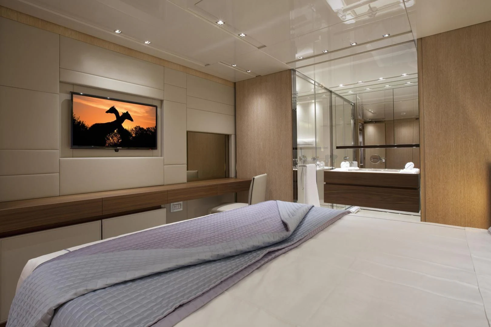 a bed with a television on the wall aboard GOLDEN YACHT Yacht for Sale
