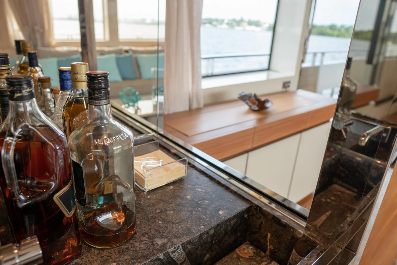 a group of bottles on a counter aboard GOLDEN YACHT Yacht for Sale