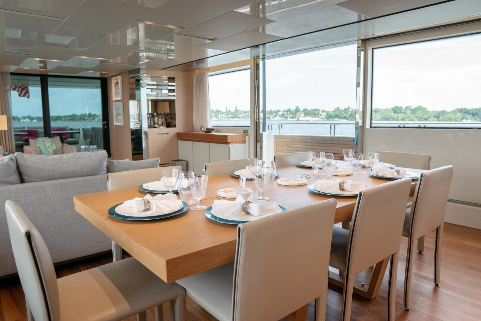 a dining table with plates and glasses aboard GOLDEN YACHT Yacht for Sale