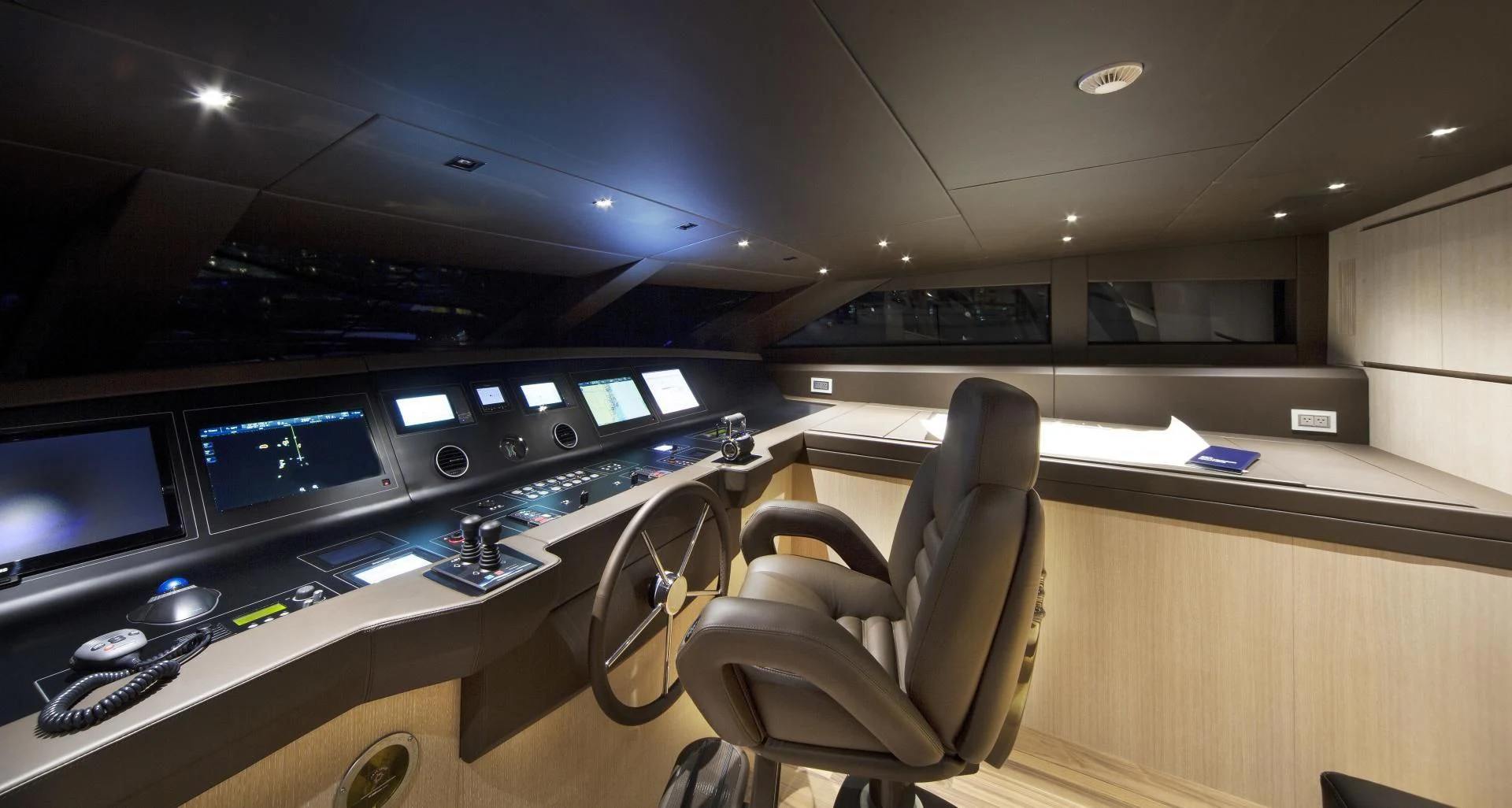 a room with a desk and chairs aboard GOLDEN YACHT Yacht for Sale