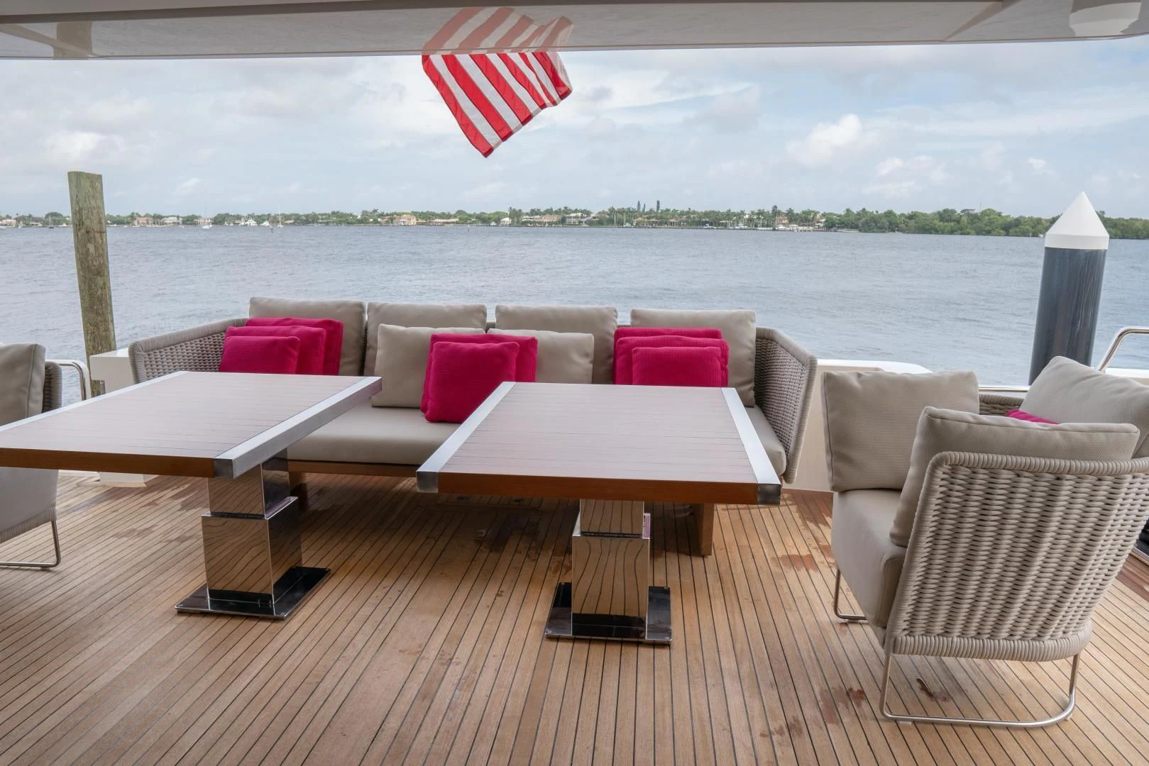 a table and chairs on a deck overlooking a body of water aboard GOLDEN YACHT Yacht for Sale