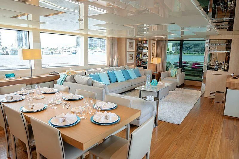 a dining room with a large window aboard GOLDEN YACHT Yacht for Sale