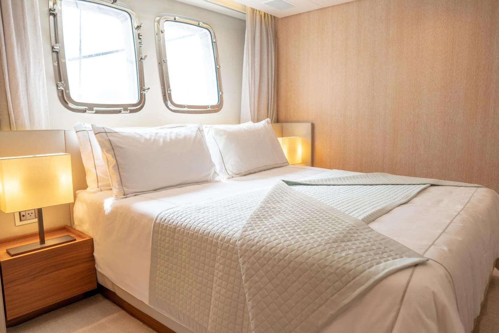 a bed with white sheets and pillows aboard GOLDEN YACHT Yacht for Sale