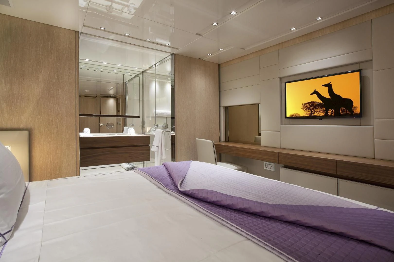 a bed with a television on the wall aboard GOLDEN YACHT Yacht for Sale