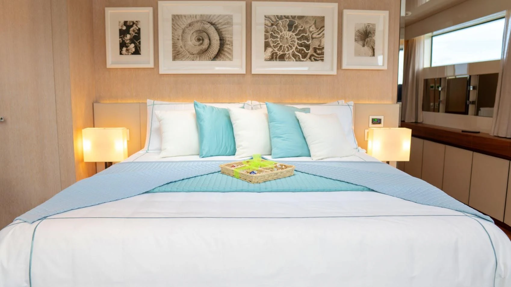 a bed with blue sheets and pillows aboard GOLDEN YACHT Yacht for Sale