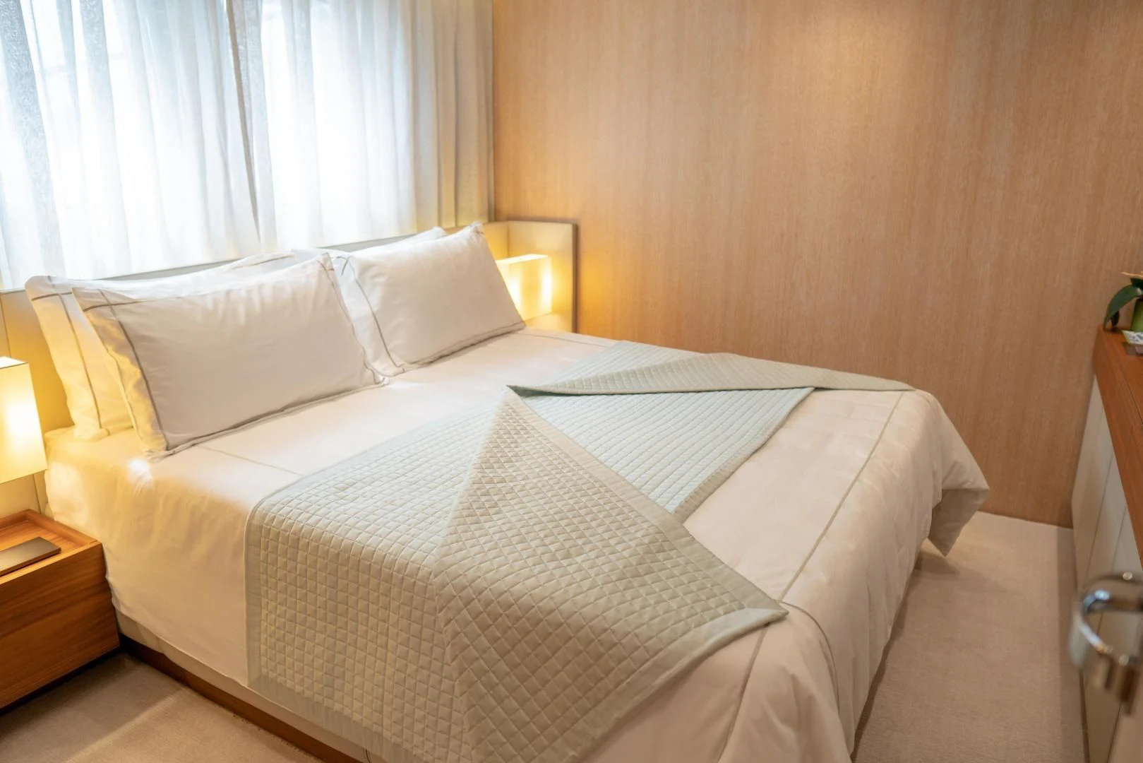 a bed with white sheets aboard GOLDEN YACHT Yacht for Sale