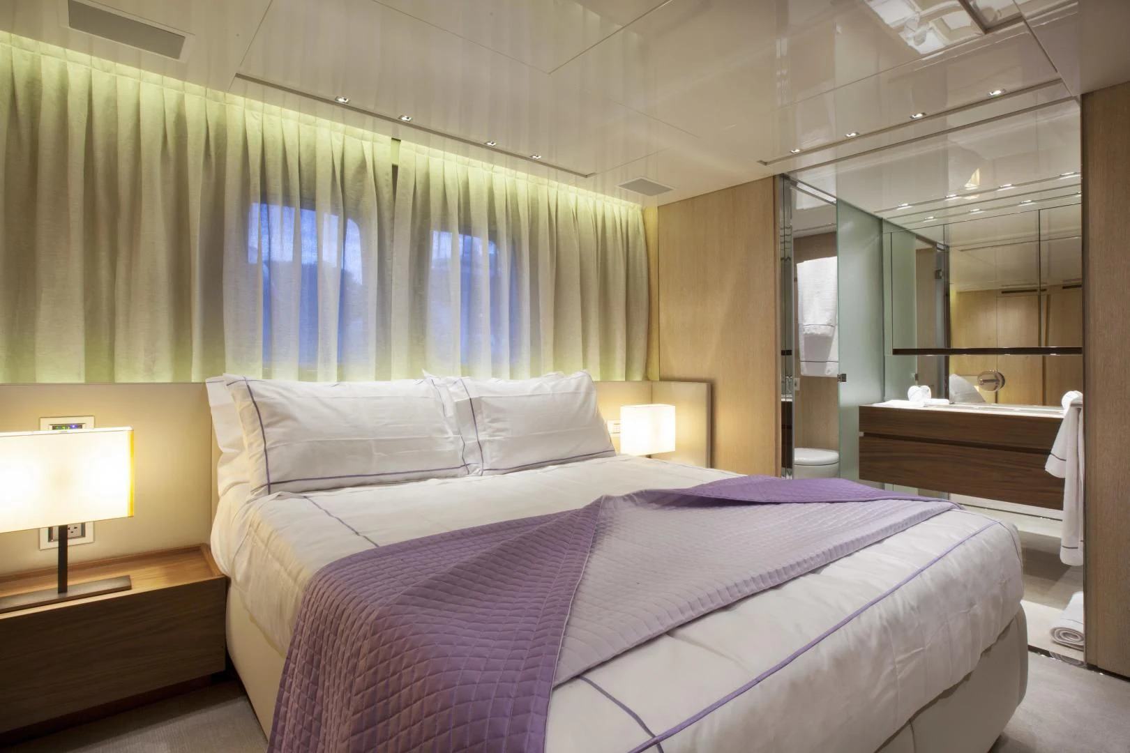 a bed with a purple sheet aboard GOLDEN YACHT Yacht for Sale