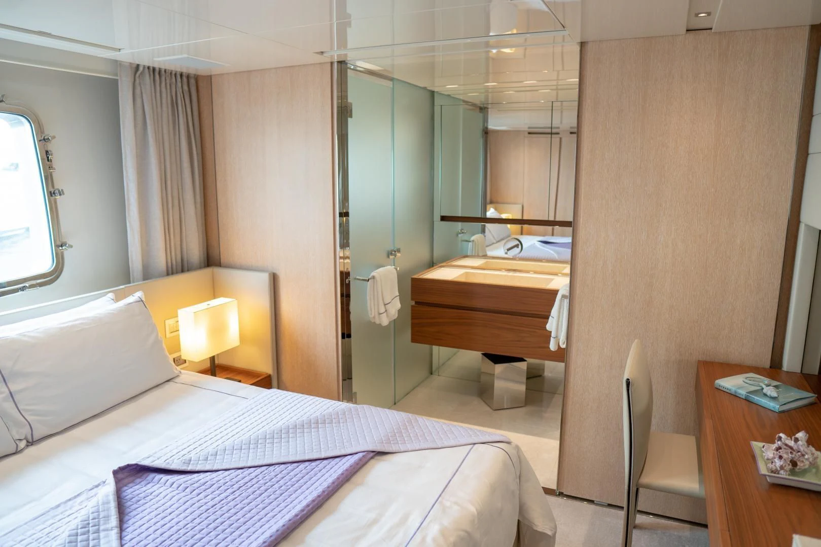 a bedroom with a bed and a mirror aboard GOLDEN YACHT Yacht for Sale