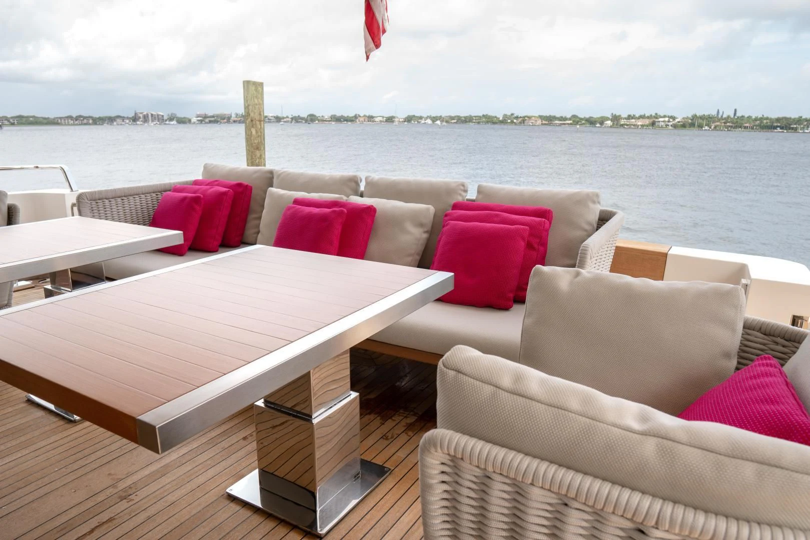 a couch and a table on a deck overlooking a body of water aboard GOLDEN YACHT Yacht for Sale