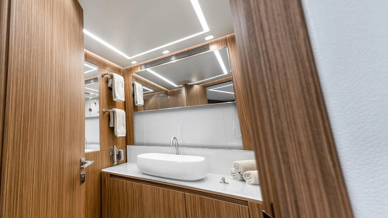 a bathroom with a sink and a mirror aboard NAAV Yacht for Sale