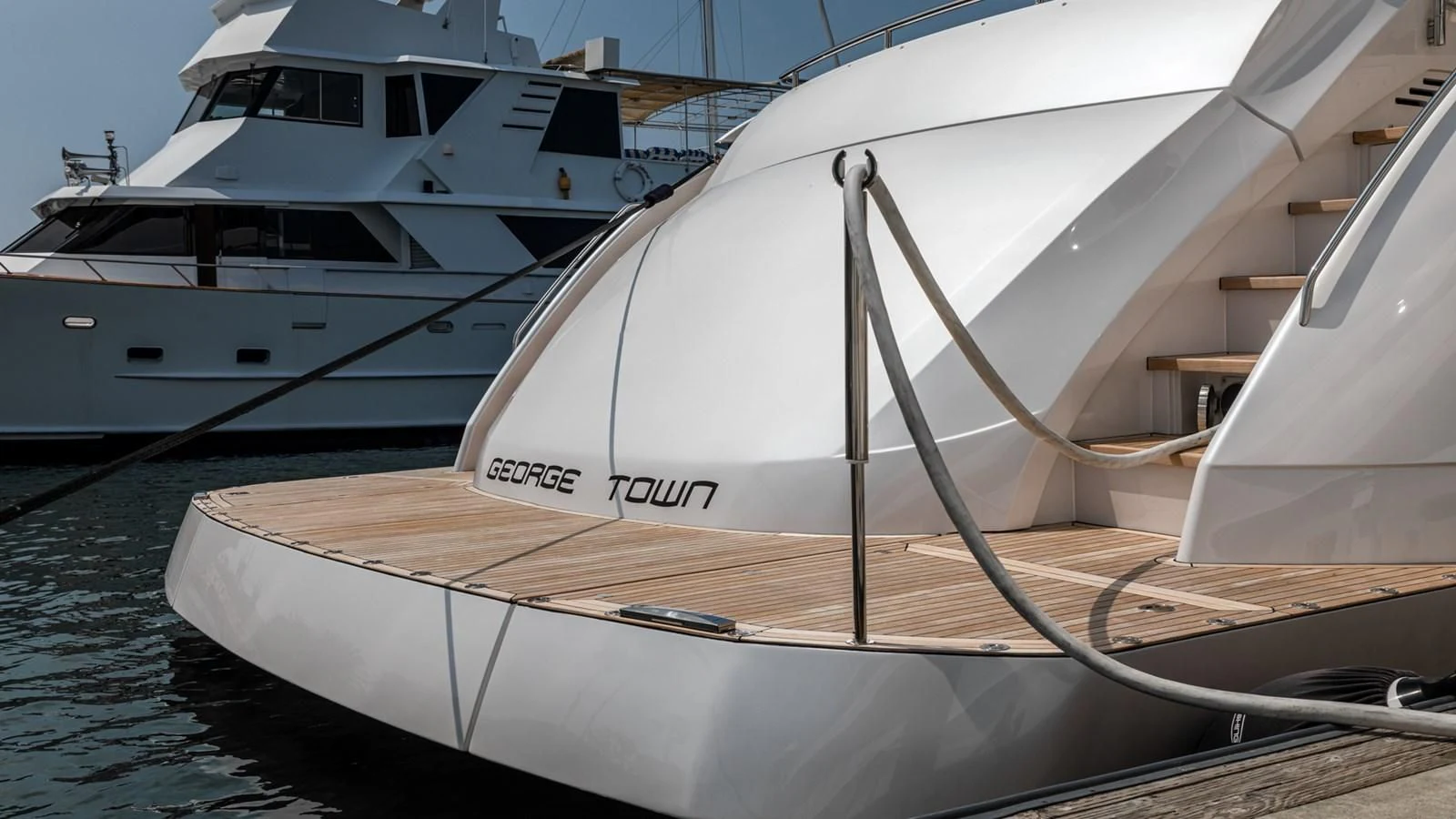 a couple of boats are parked in the water aboard NAAV Yacht for Sale