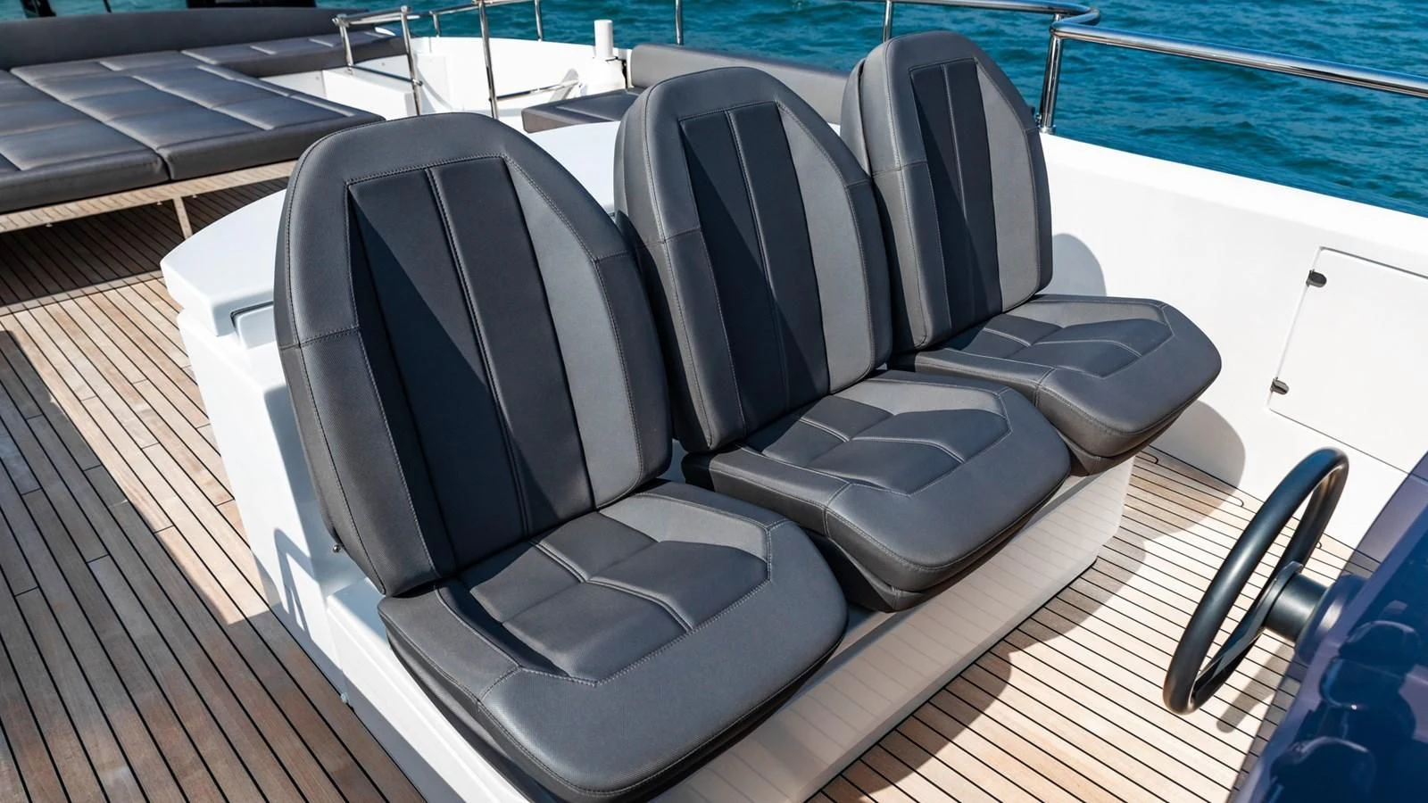 a boat with a seat aboard NAAV Yacht for Sale