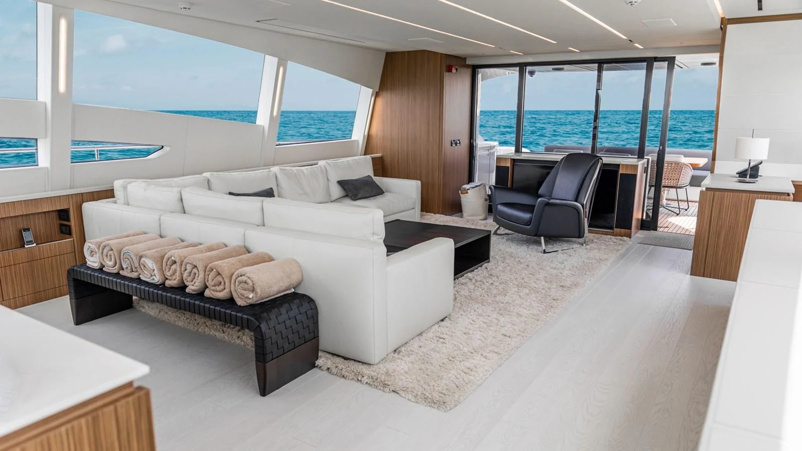 a living room with a large window aboard NAAV Yacht for Sale