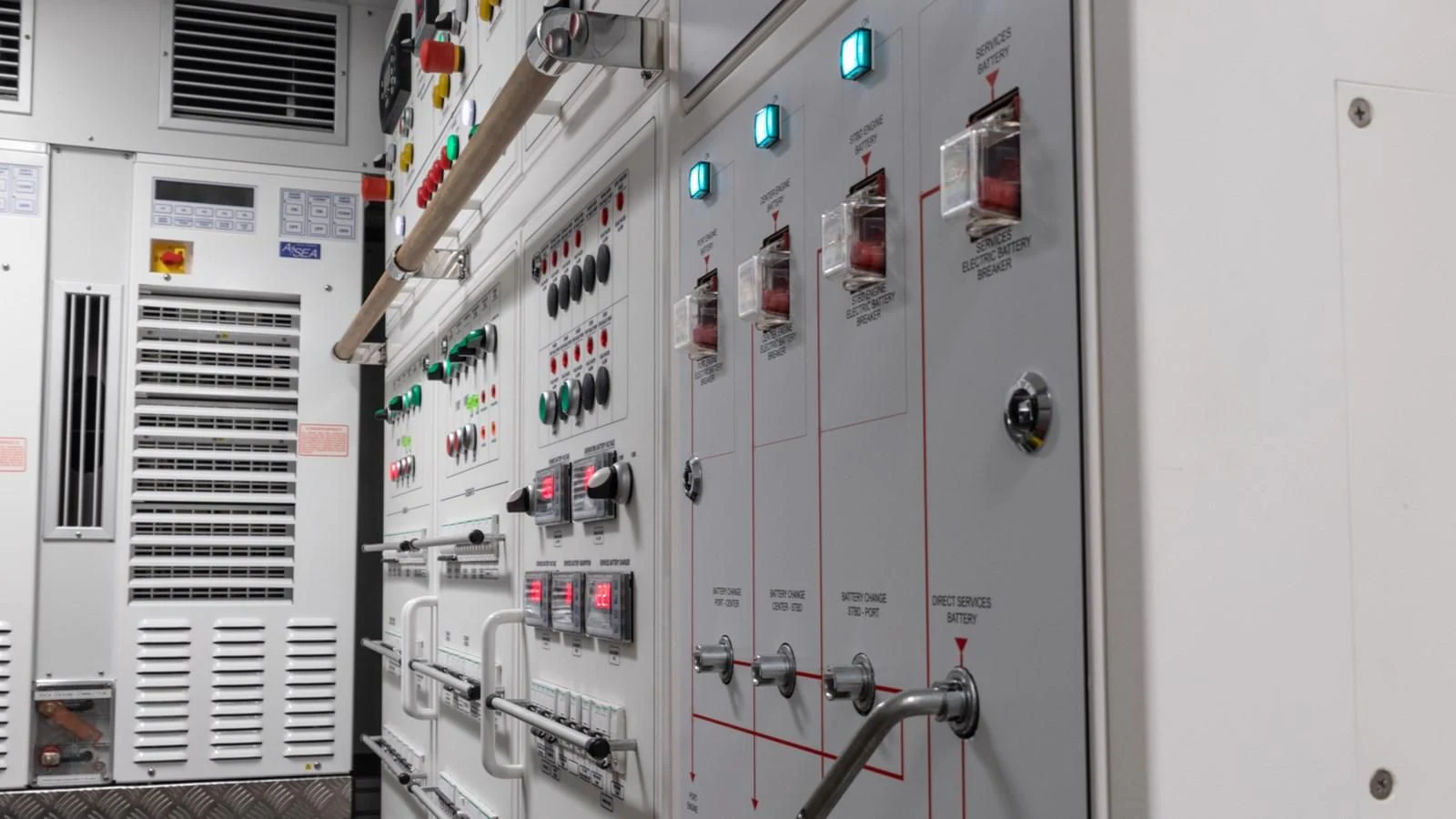 a white wall with electronic equipment aboard NAAV Yacht for Sale