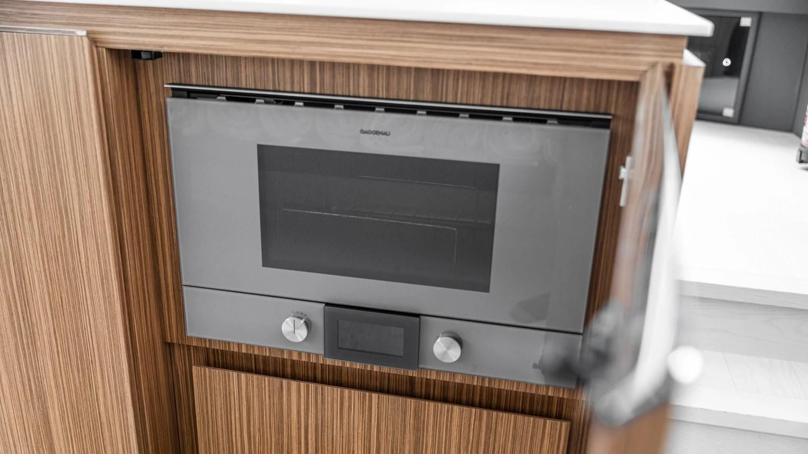 a black rectangular object on a wooden surface aboard NAAV Yacht for Sale