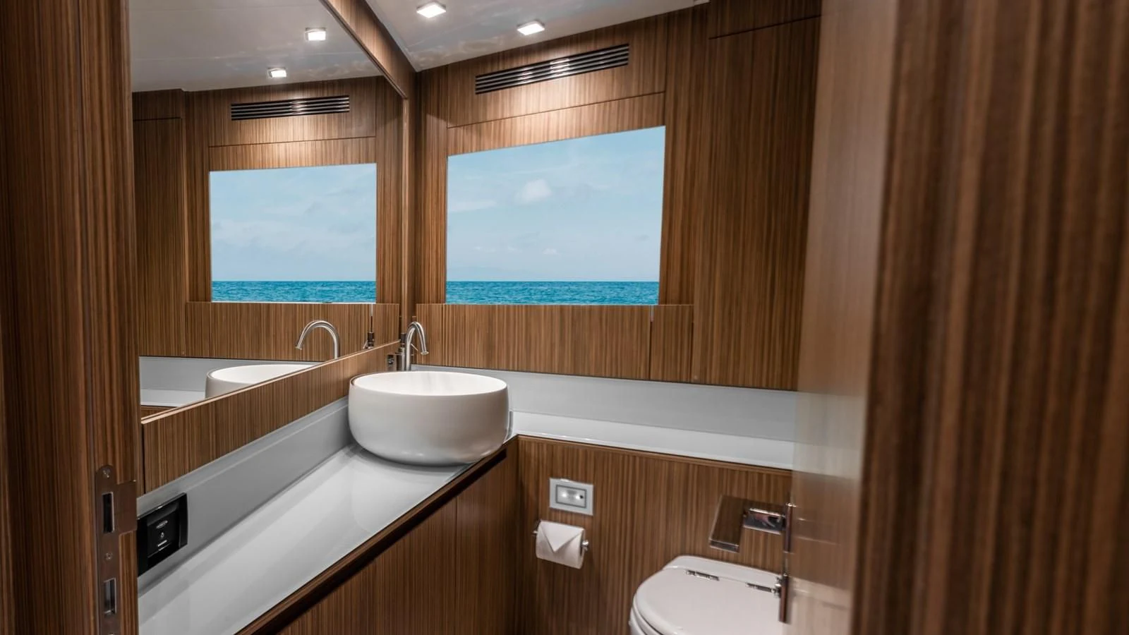 a bathroom with a sink and a window aboard NAAV Yacht for Sale