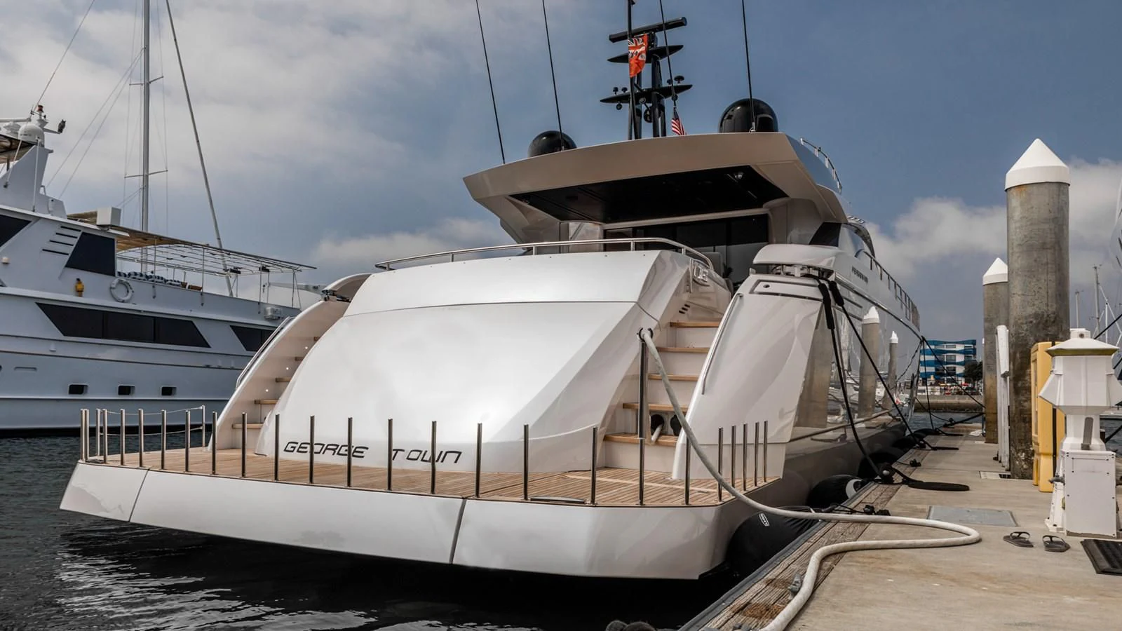 a boat docked at a pier aboard NAAV Yacht for Sale