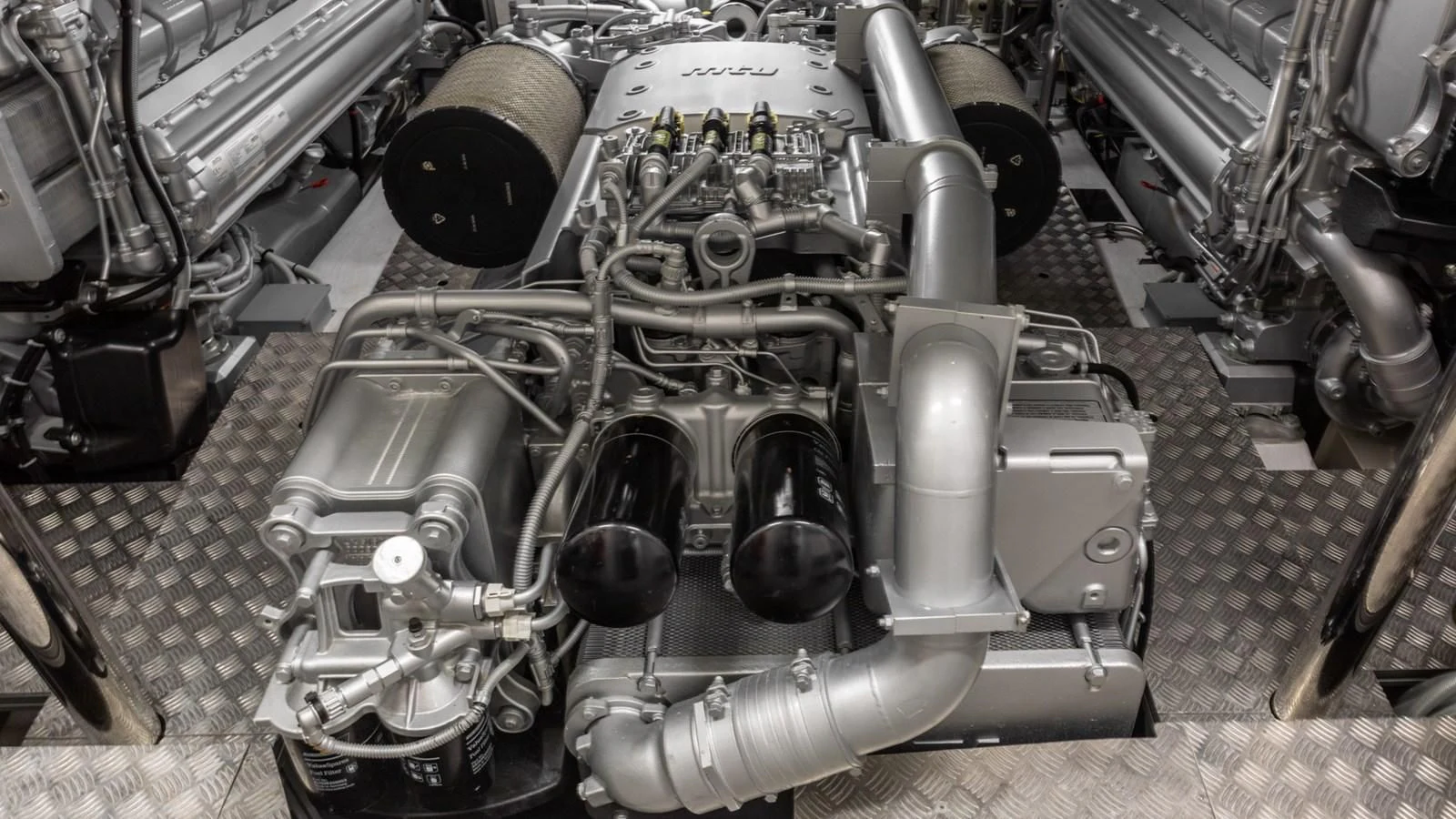 a car engine with a black hood aboard NAAV Yacht for Sale