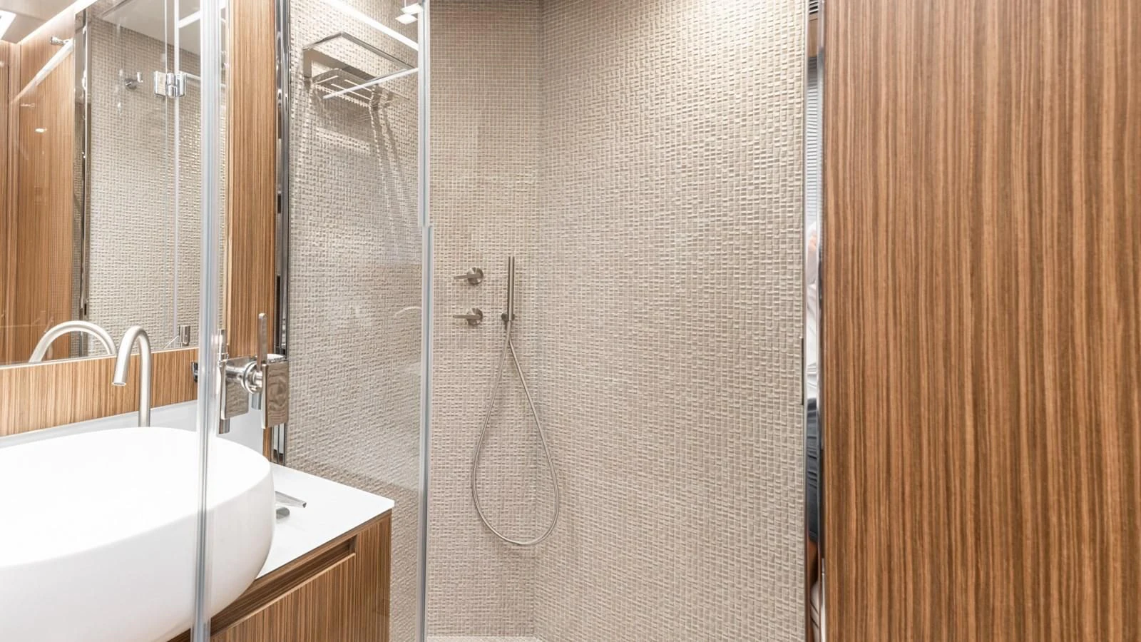 a bathroom with a sink and shower aboard NAAV Yacht for Sale