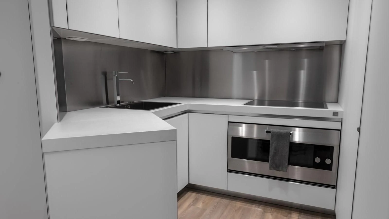 a kitchen with a stainless steel oven aboard NAAV Yacht for Sale