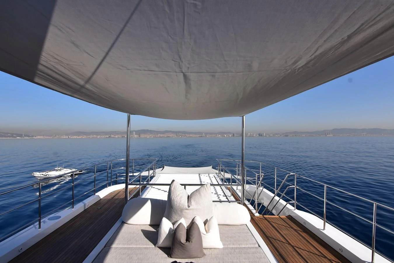a deck with chairs on it by the water aboard LIFE SAGA Yacht for Sale