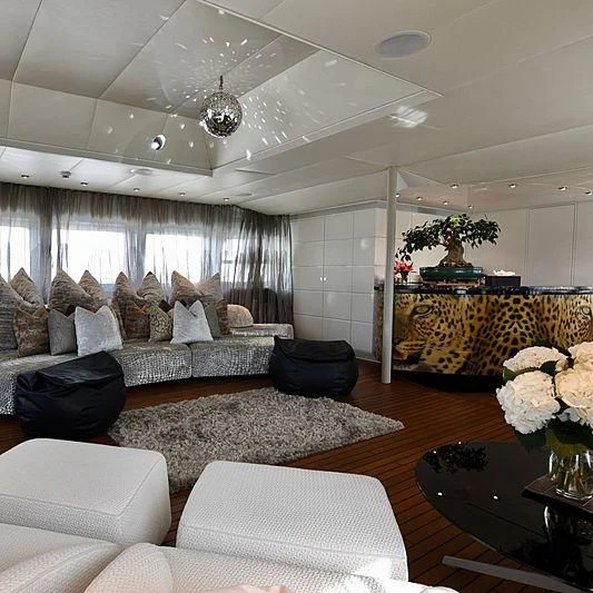 a living room with a large window aboard LIFE SAGA Yacht for Sale