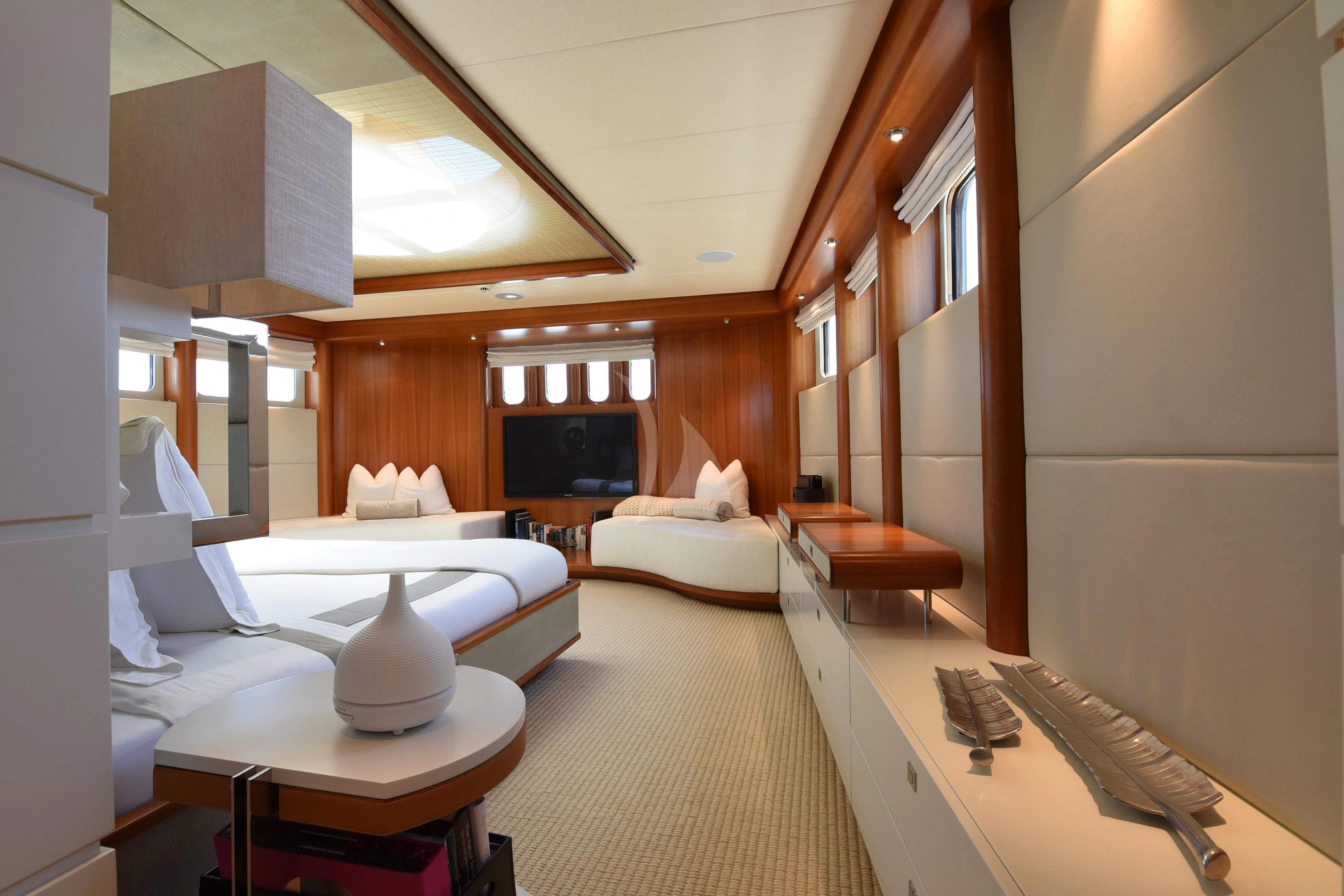 a room with a bed and a television aboard LIFE SAGA Yacht for Sale