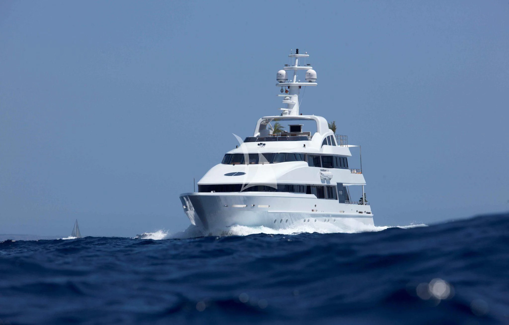 a white boat on water aboard LIFE SAGA Yacht for Sale