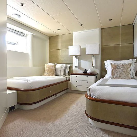 a couple of beds in a hotel room aboard LIFE SAGA Yacht for Sale