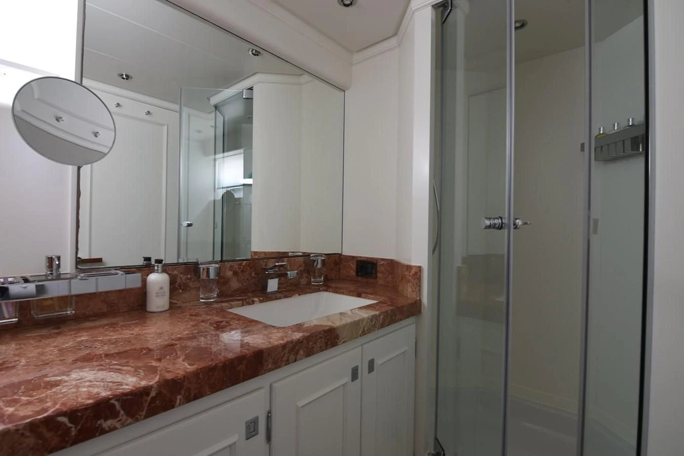 a bathroom with a large mirror aboard LIFE SAGA Yacht for Sale