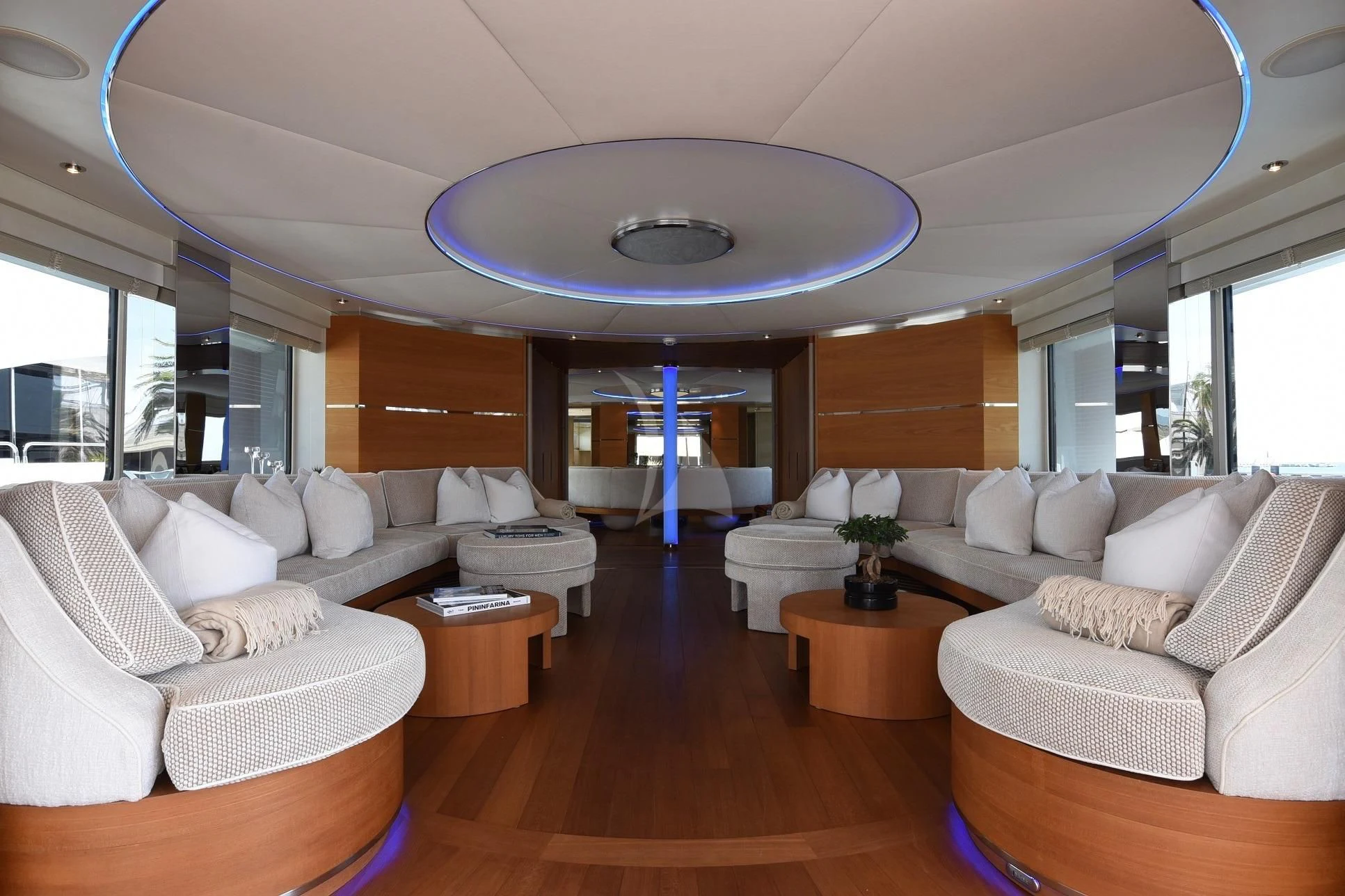 a living room with a chandelier aboard LIFE SAGA Yacht for Sale