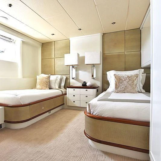 a couple of beds in a hotel room aboard LIFE SAGA Yacht for Sale