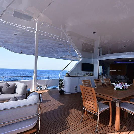a living room with a wood floor aboard LIFE SAGA Yacht for Sale