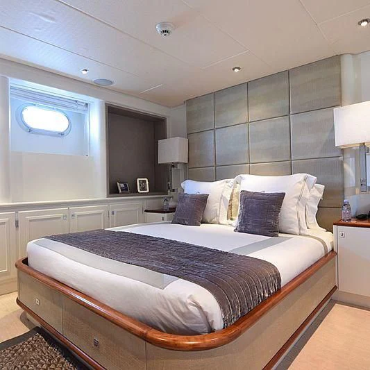 a bedroom with a bed aboard LIFE SAGA Yacht for Sale