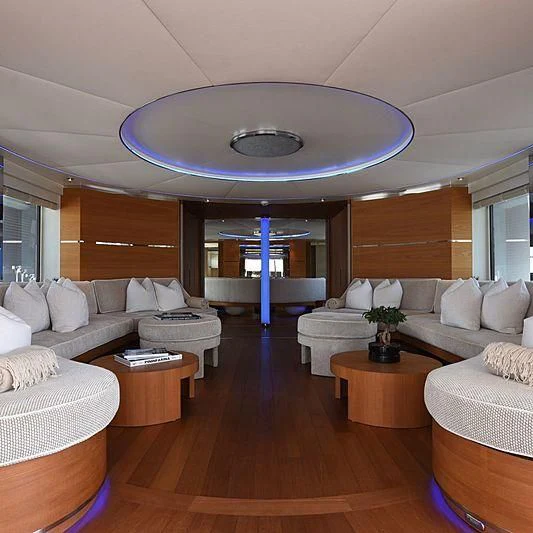 a living room with a pool table and couches aboard LIFE SAGA Yacht for Sale