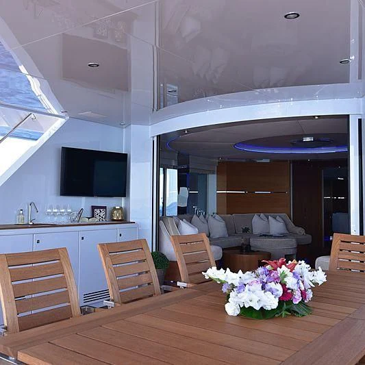 a living room with a wood floor aboard LIFE SAGA Yacht for Sale