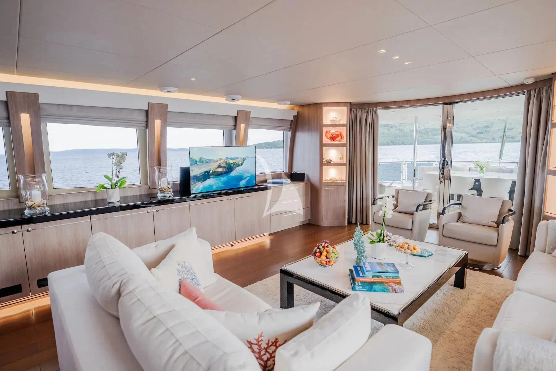 a living room with a large window aboard CARPE DIEM Yacht for Sale