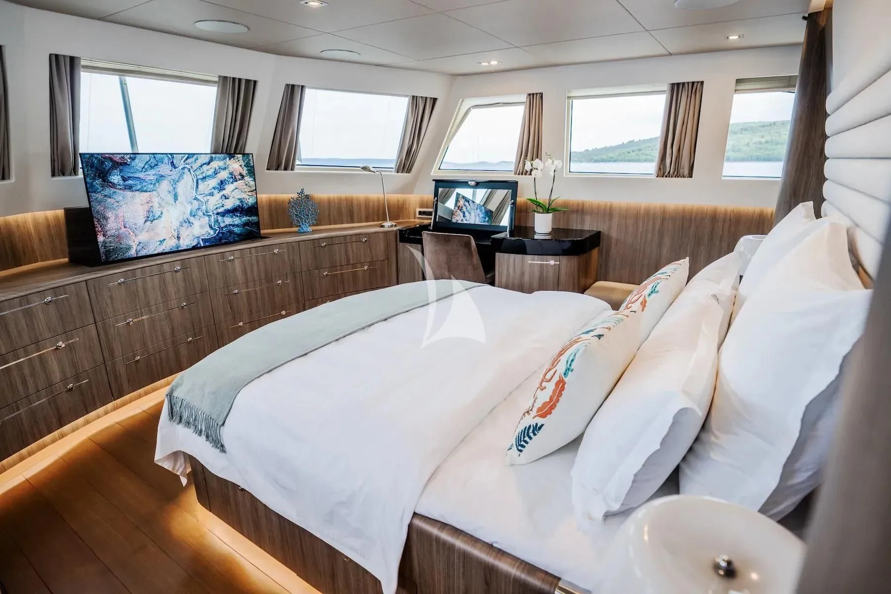 a bedroom with a bed and a television aboard CARPE DIEM Yacht for Sale