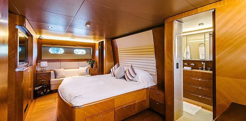 a room with a bed and a couch aboard CARPE DIEM Yacht for Sale