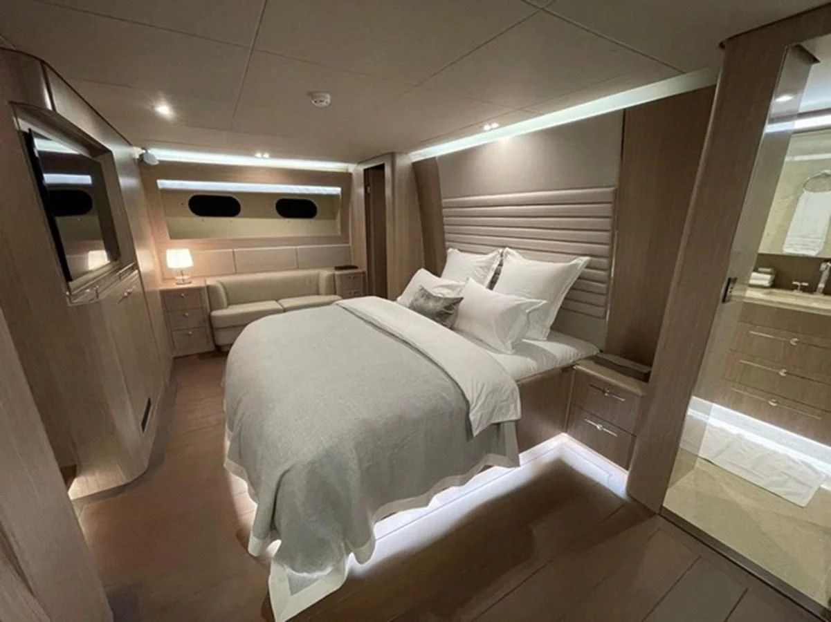 a room with a bed and a mirror aboard CARPE DIEM Yacht for Sale