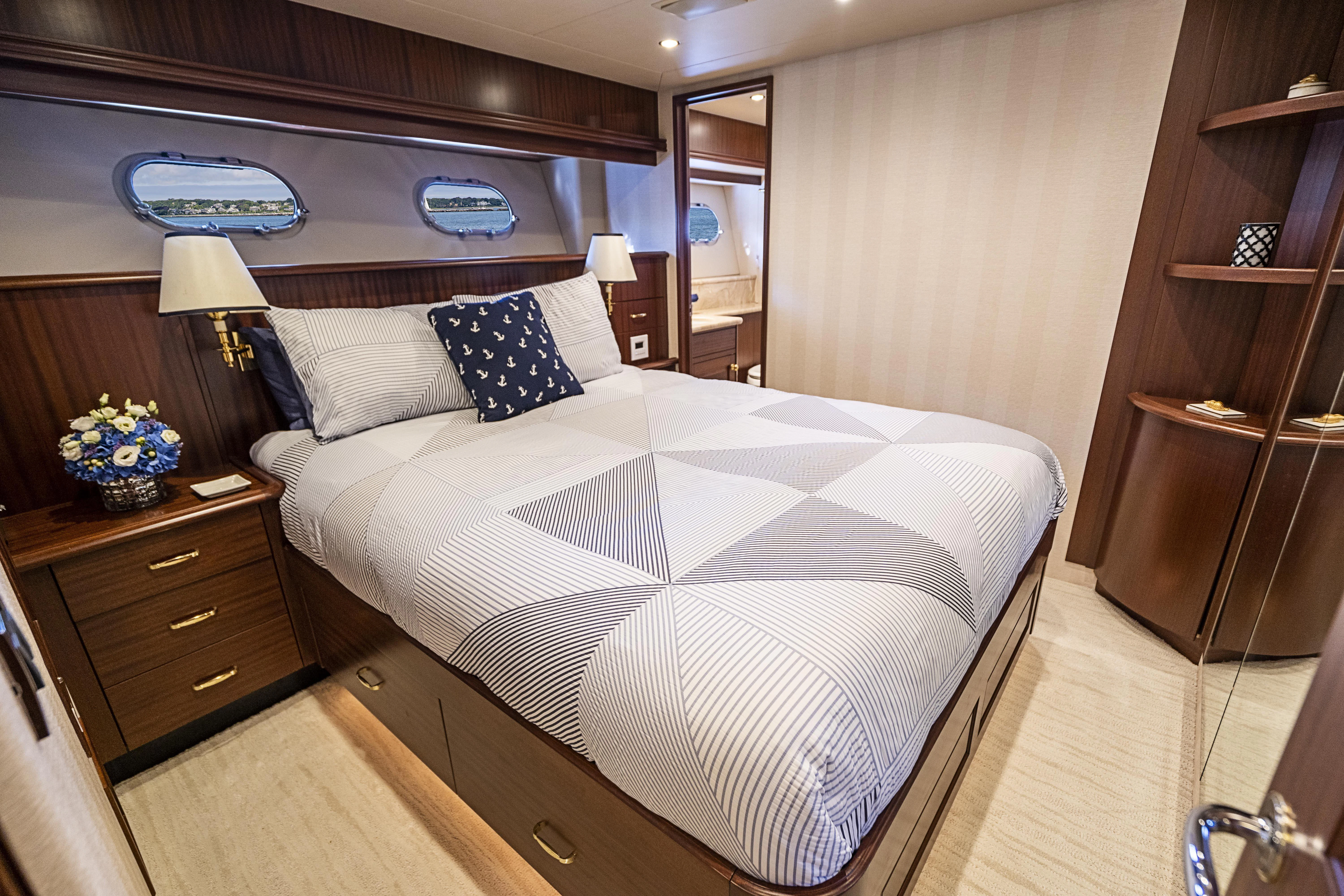 a bed in a room aboard CARPE DIEM Yacht for Sale