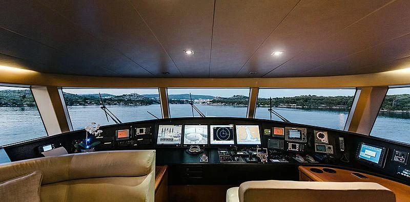 a room with a view of the water and the land below aboard CARPE DIEM Yacht for Sale