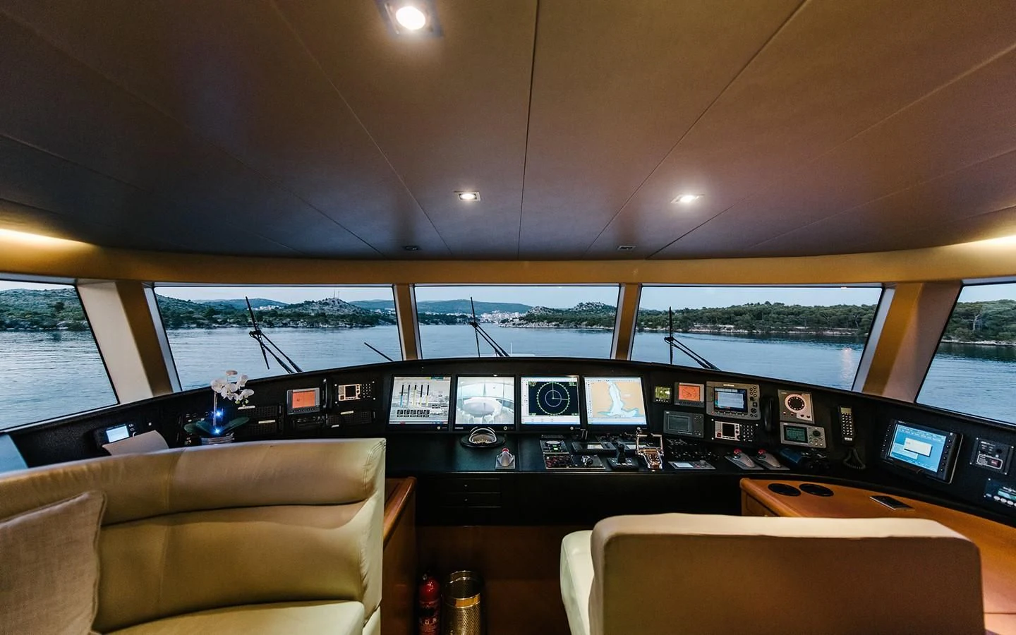 a room with a couch and a television set aboard CARPE DIEM Yacht for Sale