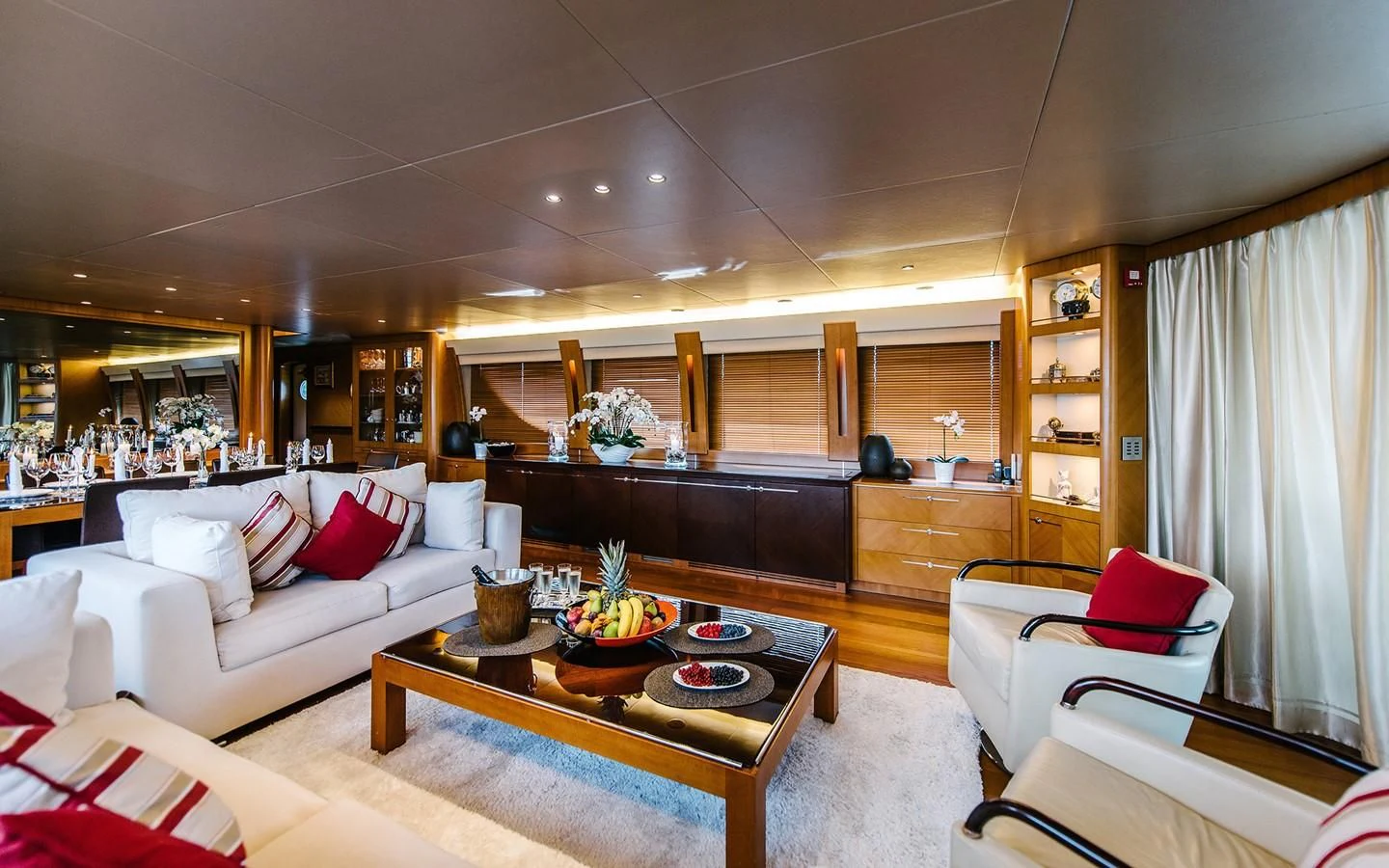 a living room with a piano aboard CARPE DIEM Yacht for Sale