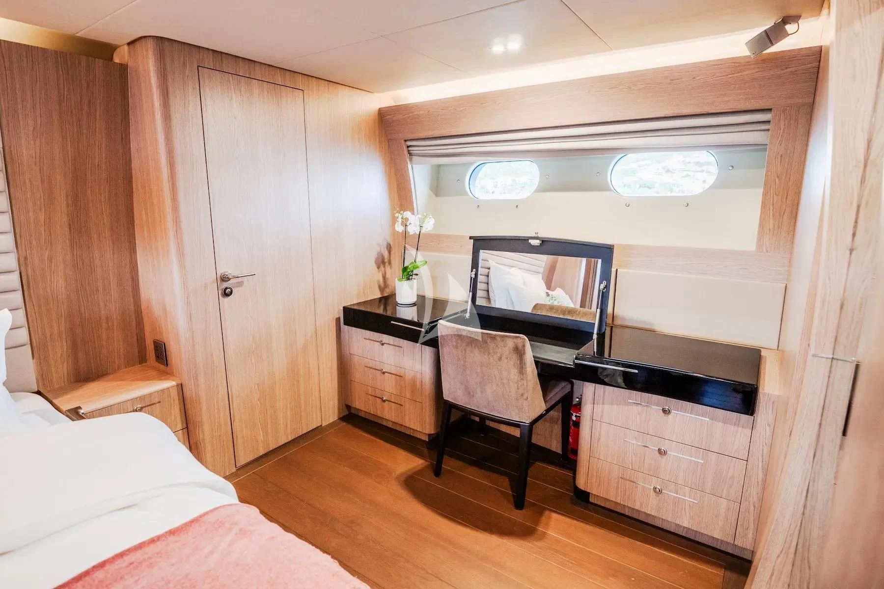 a room with a bed and a desk aboard CARPE DIEM Yacht for Sale