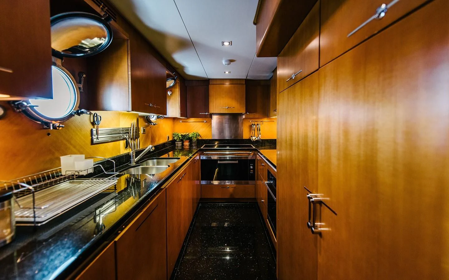 a kitchen with a large island aboard CARPE DIEM Yacht for Sale